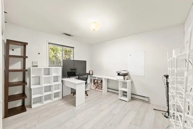 an aerial view of residential houses with outdoor space