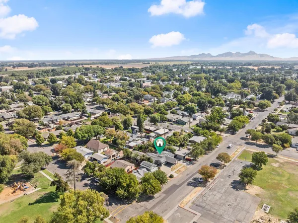 an aerial view of residential houses with outdoor space