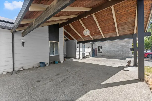 a view of an entryway with wooden floor