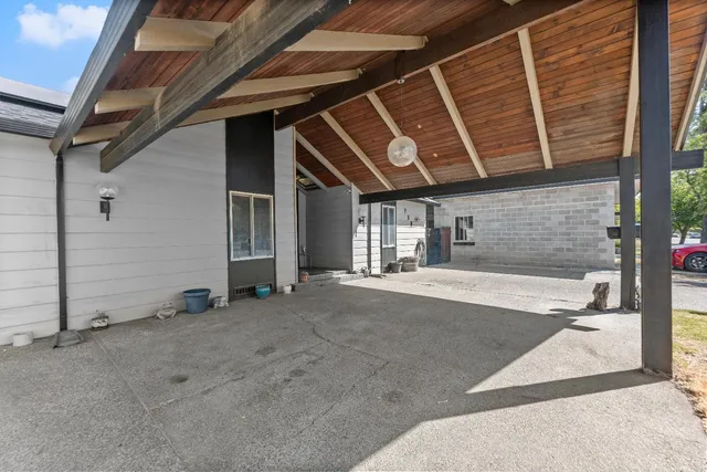 a view of an entryway with wooden floor