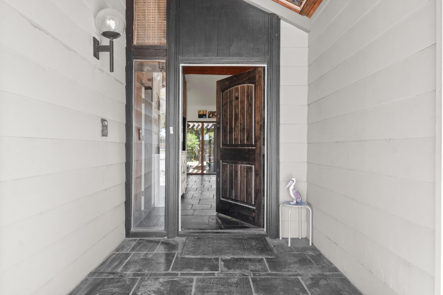 738 Webster Street Colusa, CA 95932 - Photo 9 of 56 a view of a hallway with a glass door and couch