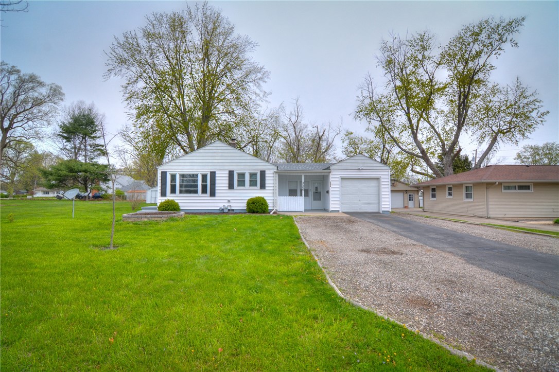 3506 East Leafdale Avenue Decatur, IL 62521 - Photo 4 of 25 a front view of a house with garden