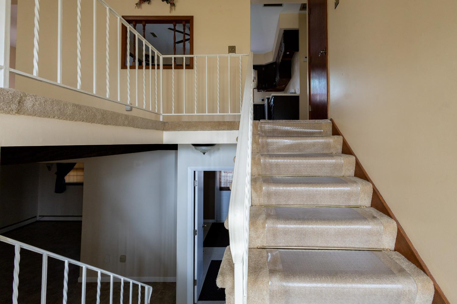 934 West Pine Street Griffith, IN 46319 - Photo 2 of 12 a view of staircase with lots of frames on wall and a window