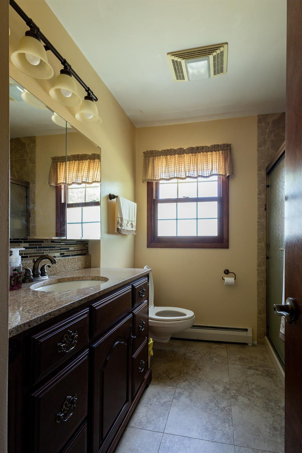 934 West Pine Street Griffith, IN 46319 - Photo 8 of 12 a bathroom with a sink and a mirror
