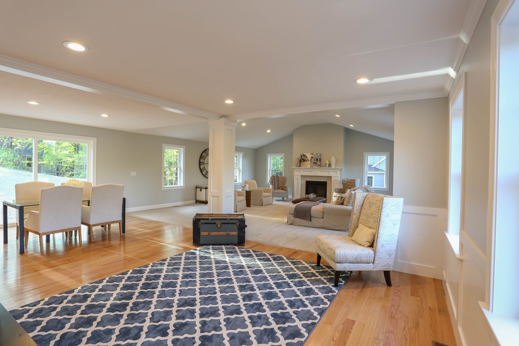 14 Spring Street Hopkinton, MA 01748 - Photo 6 of 16 a living room with furniture and a fireplace