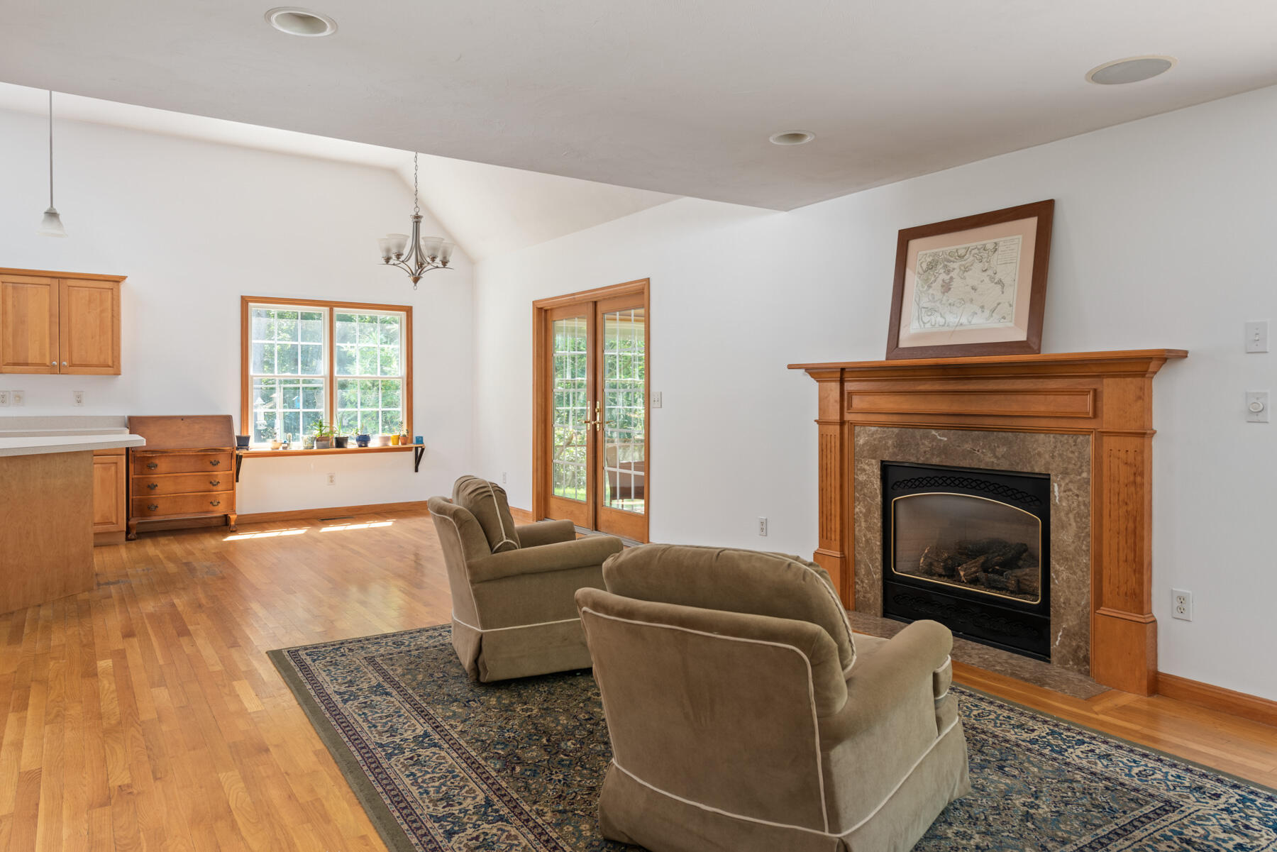 25 Gilbert Lane Harwich Port, MA 02646 - Photo 12 of 25 a living room with furniture and a fireplace