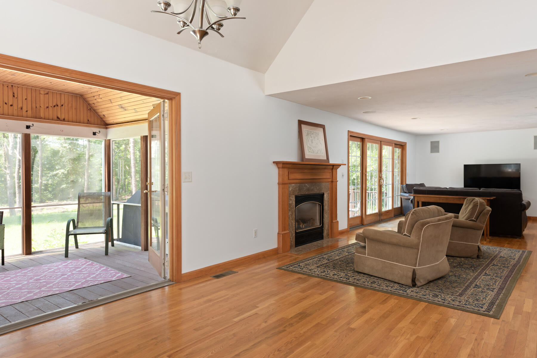 25 Gilbert Lane Harwich Port, MA 02646 - Photo 13 of 25 a living room with furniture and a fireplace
