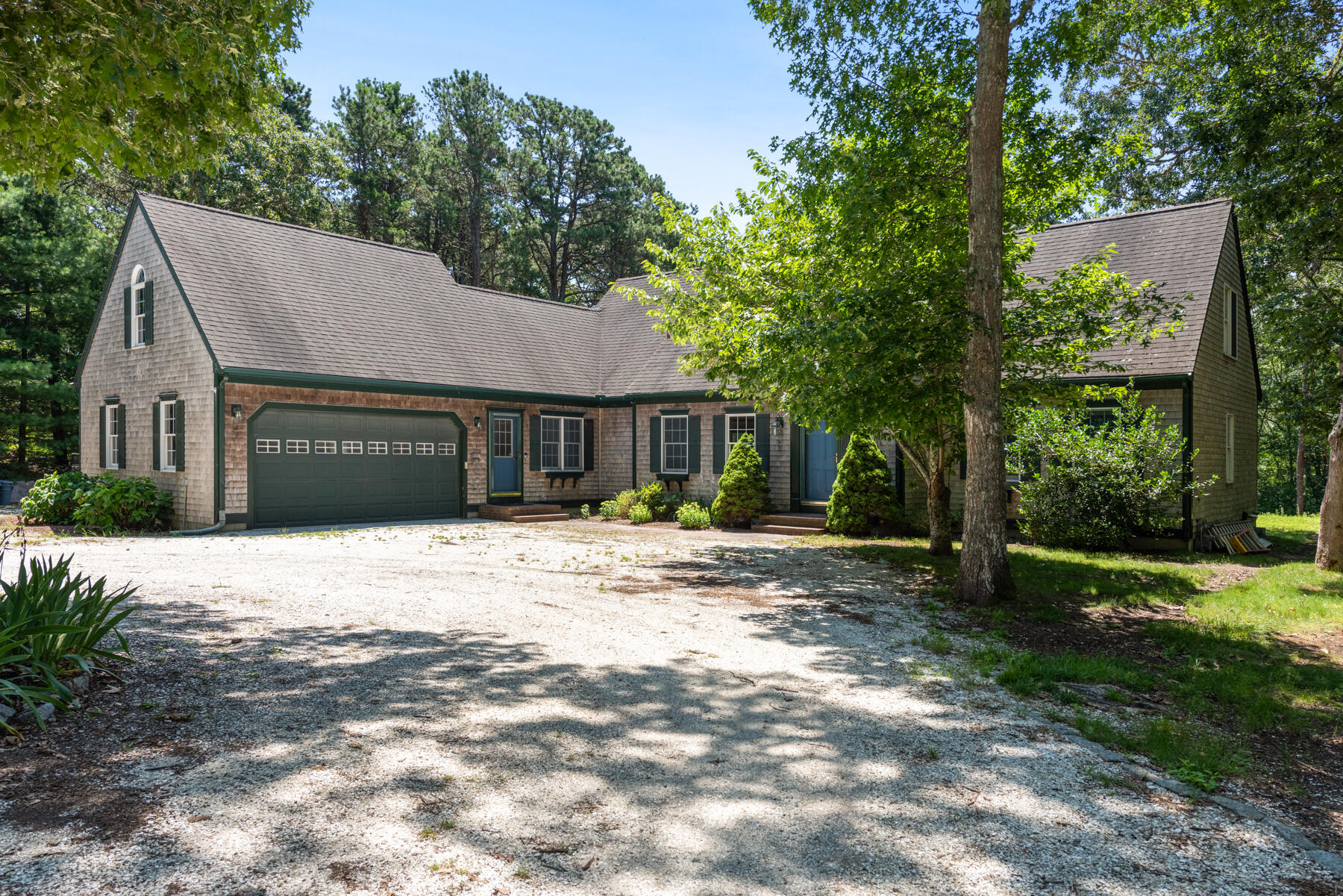25 Gilbert Lane Harwich Port, MA 02646 - Photo 2 of 25 a view of a house with a yard and large tree