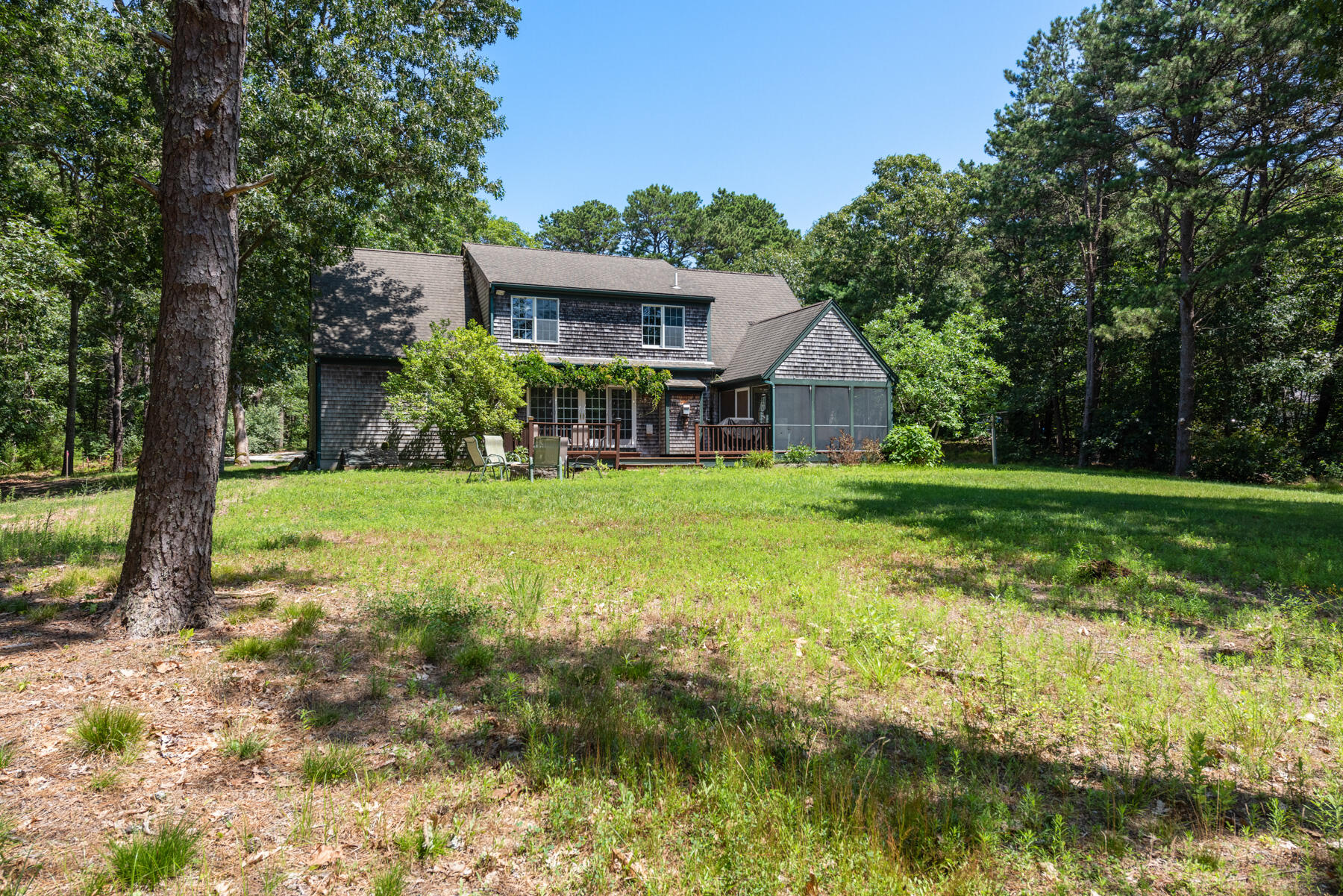 25 Gilbert Lane Harwich Port, MA 02646 - Photo 3 of 25 a view of a house with a yard and sitting area