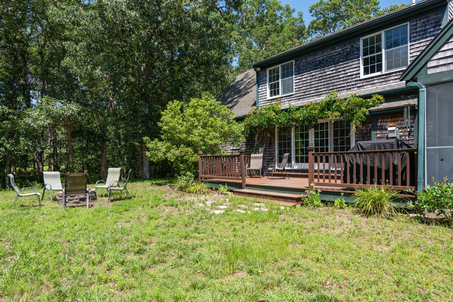 25 Gilbert Lane Harwich Port, MA 02646 - Photo 5 of 25 a view of house with backyard and sitting area