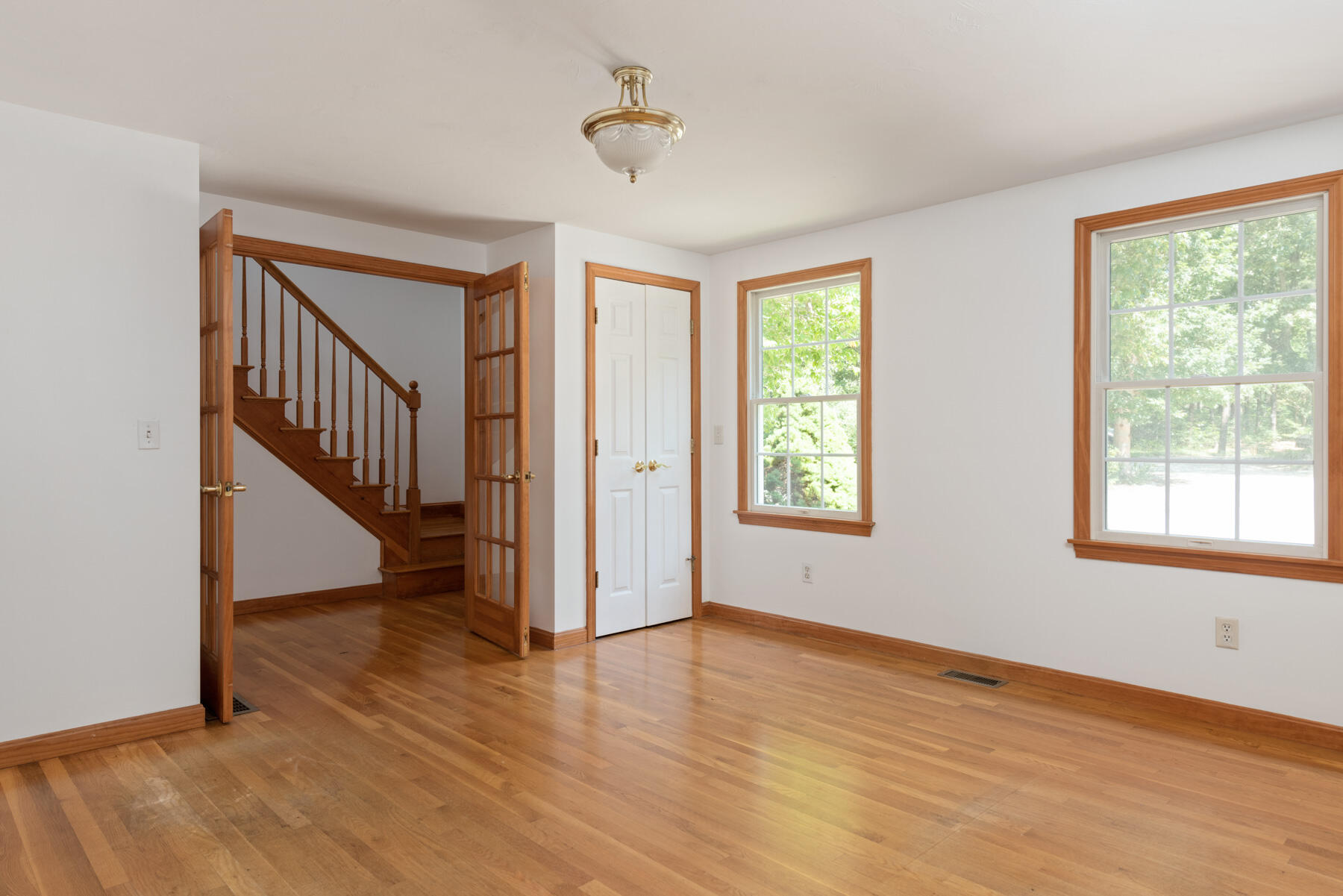 25 Gilbert Lane Harwich Port, MA 02646 - Photo 8 of 25 a view of an entryway with wooden floor and windows
