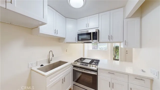 a view of hallway with wooden floor