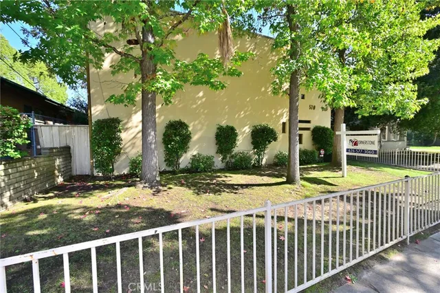 a view of a house with a backyard