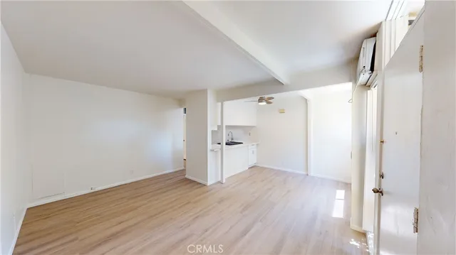 a kitchen with stainless steel appliances a sink a stove and cabinets