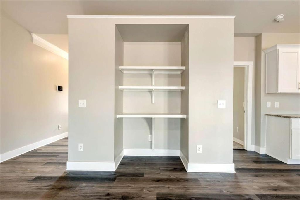 482 North Point Circle Hartwell, GA 30643 - Photo 14 of 32 a view of an empty room with wooden floor and a window