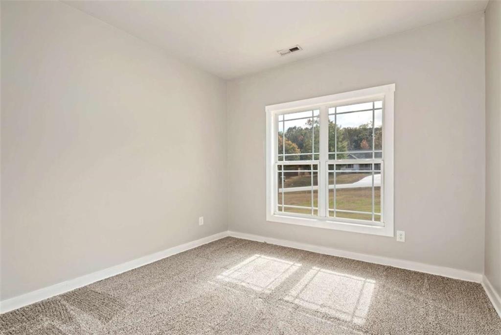 482 North Point Circle Hartwell, GA 30643 - Photo 17 of 32 an empty room with a window