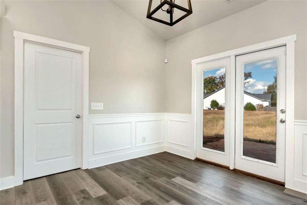482 North Point Circle Hartwell, GA 30643 - Photo 28 of 32 a view of an empty room with wooden floor and a window