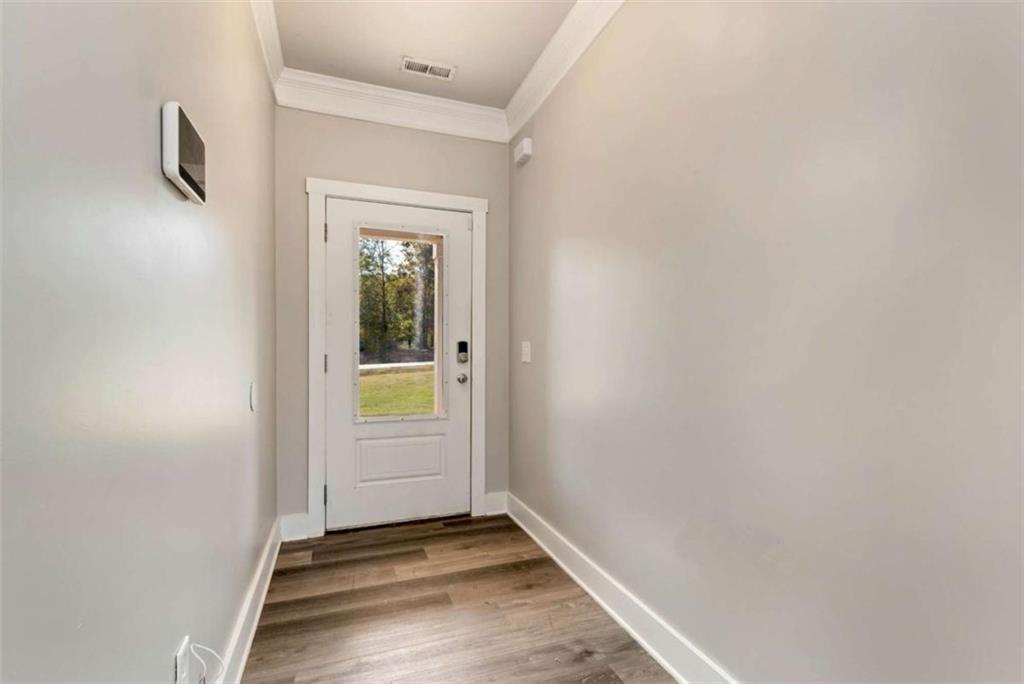482 North Point Circle Hartwell, GA 30643 - Photo 4 of 32 a view of an empty room with closet and a window