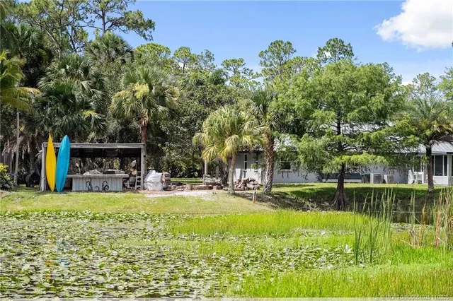 a view of a kitchen with a sink and a stove top oven