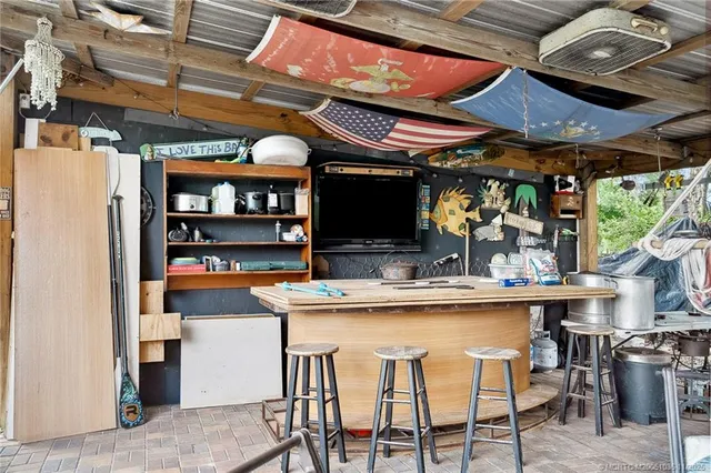 a kitchen with stainless steel appliances granite countertop a sink stove and microwave