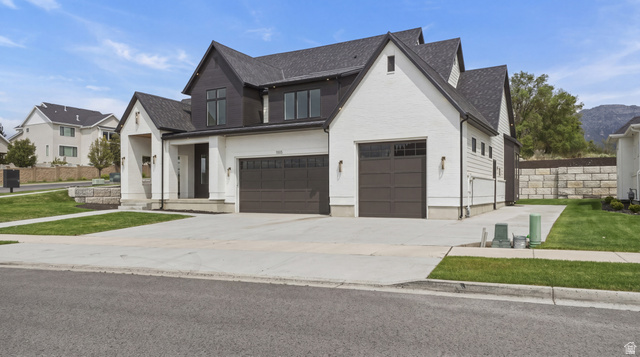 1682 North 1950 W Street, Unit 9 Provo, UT 84604 - Photo 4 of 84 Modern farmhouse-style exterior featuring white siding, dark trim, and a dark shingle roof