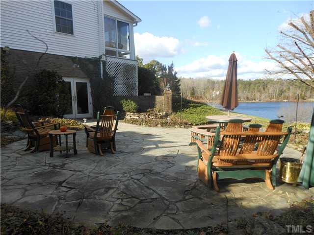 766 Flint Ridge Road Prospect Hill, NC 27314 - Photo 3 of 25 Private stone patio overlooking the lake.