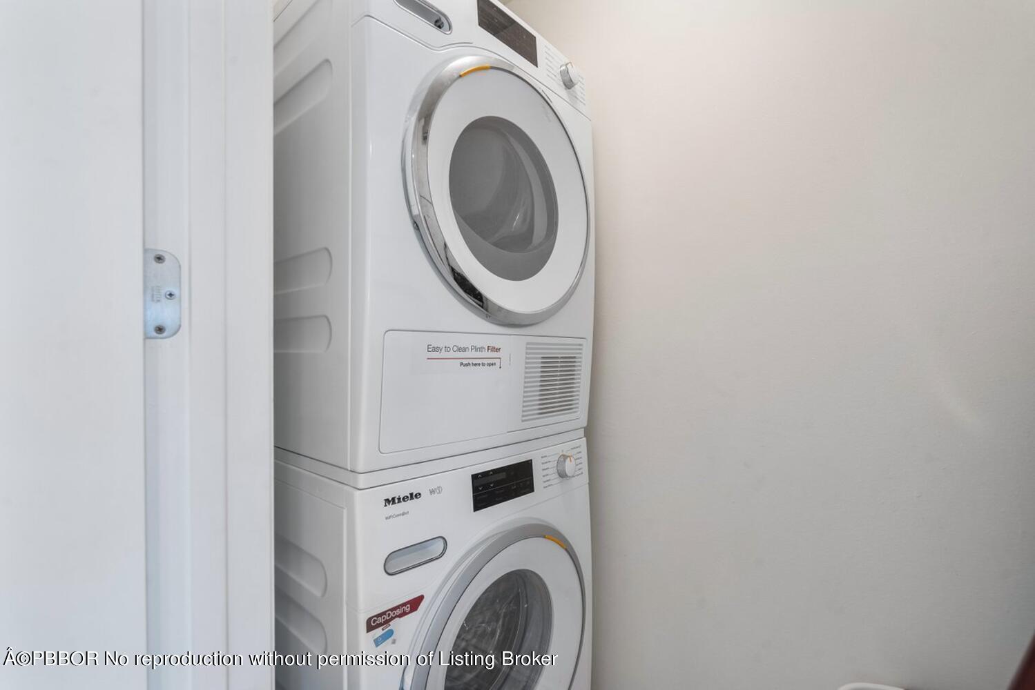 2195 Ibis Isle Road, Unit 7 Palm Beach, FL 33480 - Photo 13 of 34 a utility room with dryer and washer