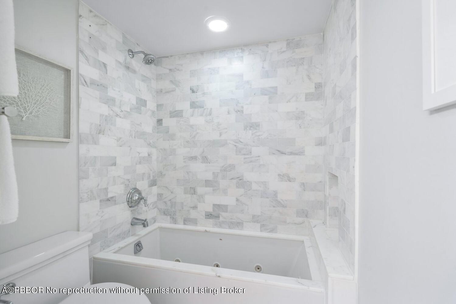 2195 Ibis Isle Road, Unit 7 Palm Beach, FL 33480 - Photo 24 of 34 a bath tub sitting next to a white toilet