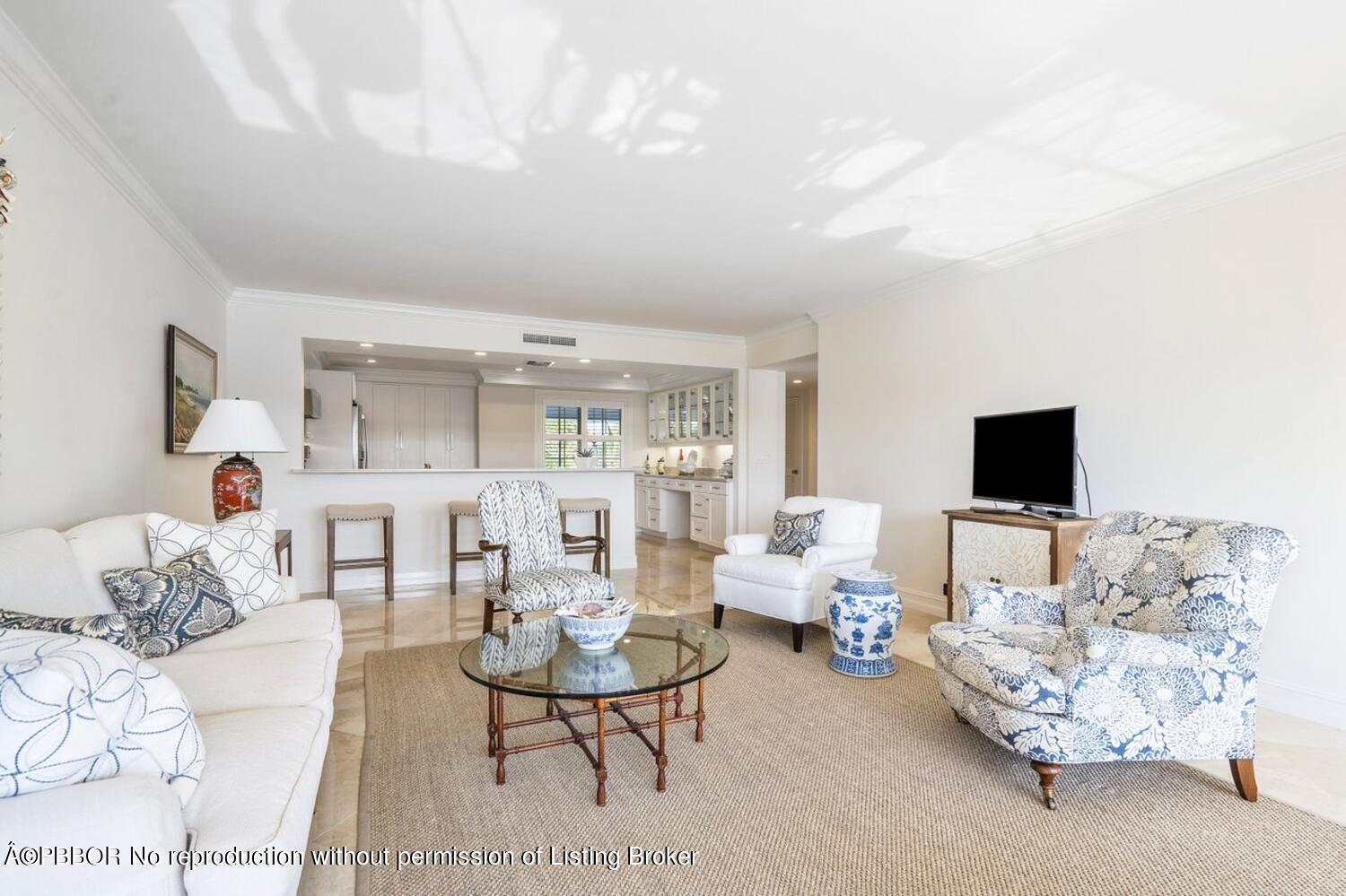 2195 Ibis Isle Road, Unit 7 Palm Beach, FL 33480 - Photo 6 of 34 a living room with furniture and a flat screen tv