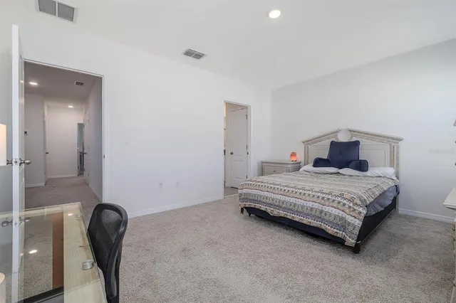 a bathroom with a double vanity sink toilet and shower