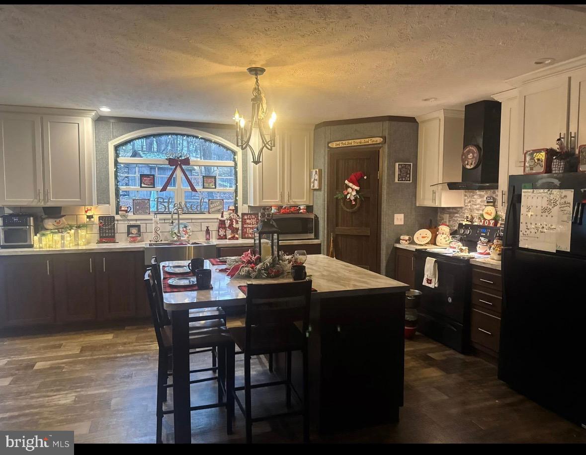 10134 Piney Mountain Road Southwest Frostburg, MD 21532 - Photo 7 of 15 a kitchen with a table and chairs in it