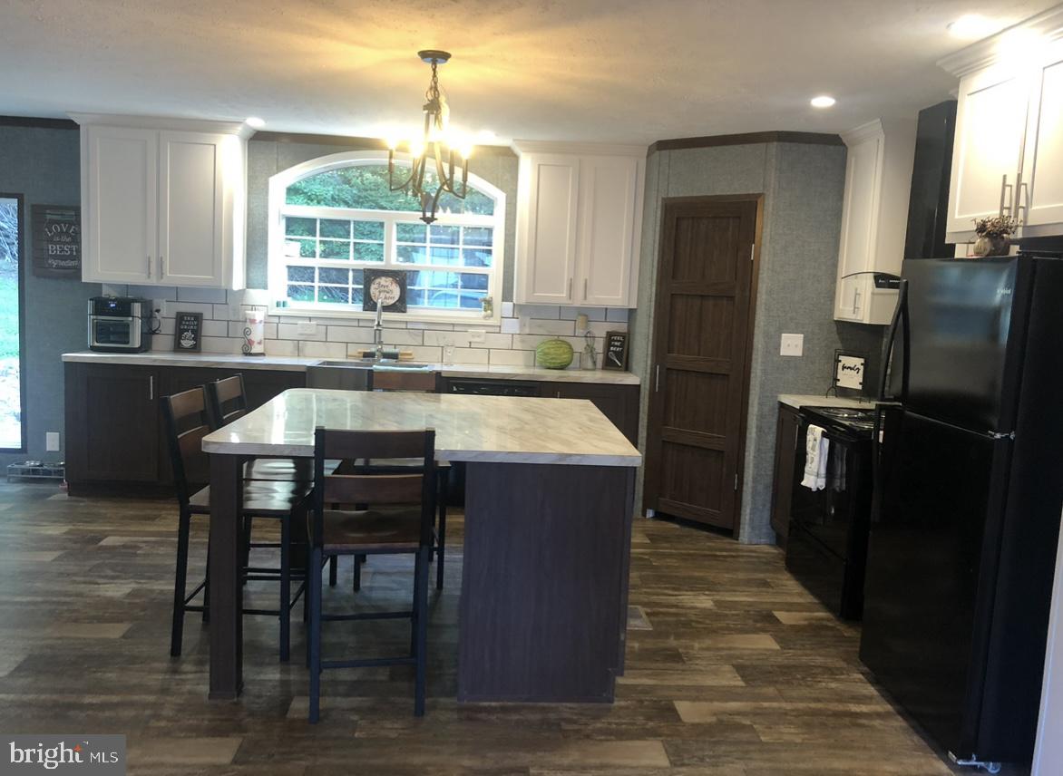 10134 Piney Mountain Road Southwest Frostburg, MD 21532 - Photo 8 of 15 a large kitchen with a table and chairs