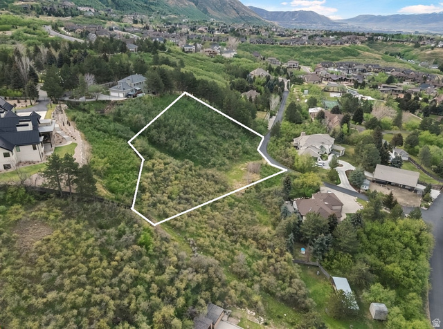 10667 Hidden Ridge Lane Sandy, UT 84092 - Photo 9 of 21 Aerial view of residential area featuring property parcel outlined and mountains