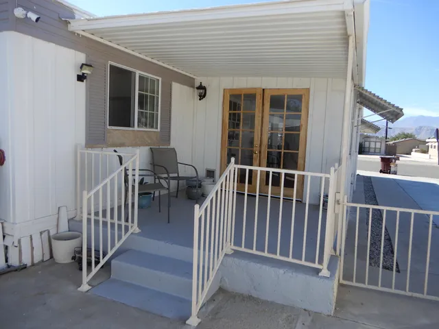 a view of a balcony and chairs