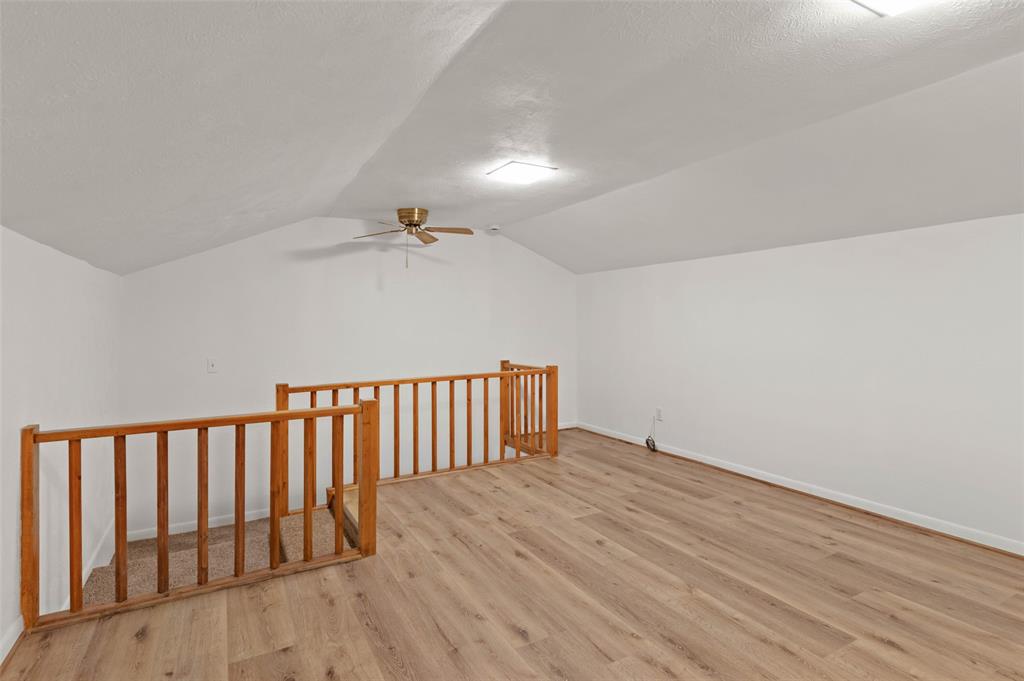 301 East 6th Street Krum, TX 76249 - Photo 23 of 29 Upstairs bonus room that could be a game room or a fourth bedroom.