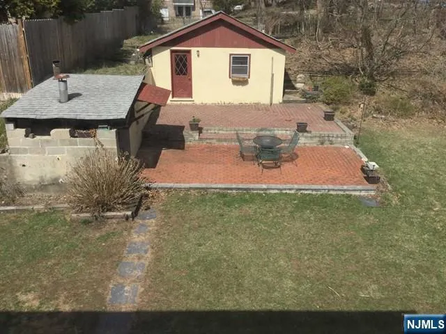 a view of a yard with a patio