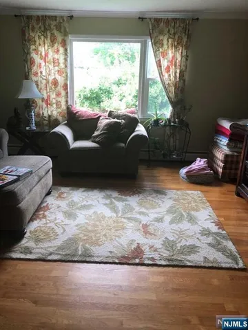a living room with furniture window and a table