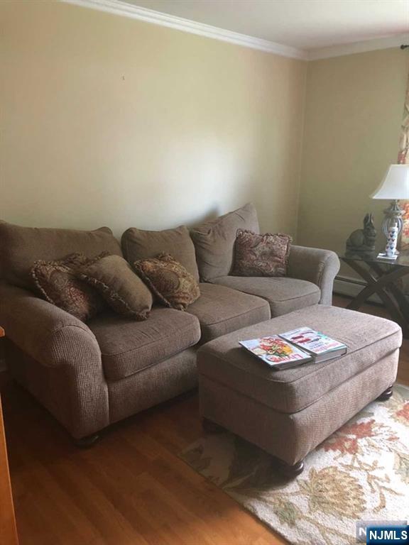79 Rock Road, Unit 1 Hawthorne, NJ 07506 - Photo 3 of 12 a living room with furniture and a couch