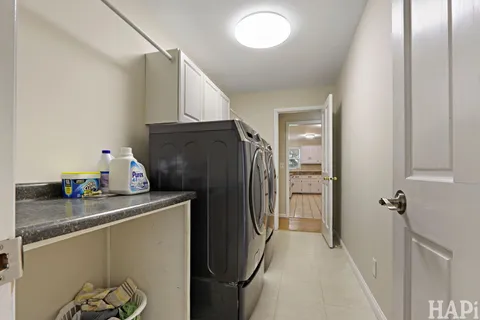 a kitchen with a refrigerator and cabinets