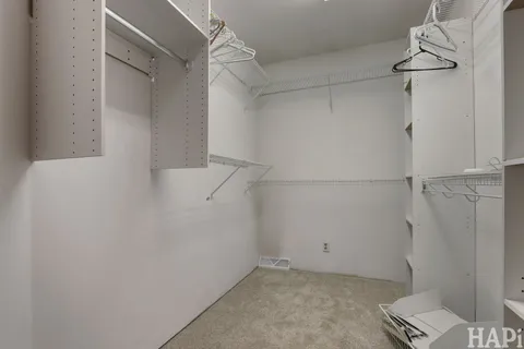 a view of a room with racks on the wall
