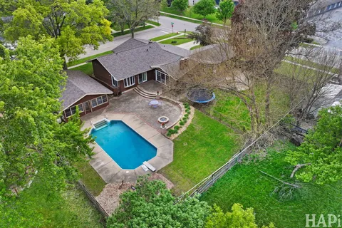 an aerial view of a house with outdoor space