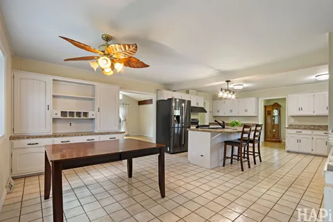a kitchen with a table and chairs in it
