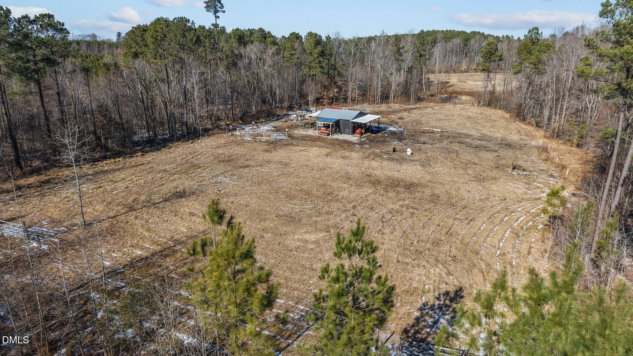 0 Taylor's Store Road Nashville, NC 27856 - Photo 8 of 12 a view of a backyard with table and chairs with wooden fence
