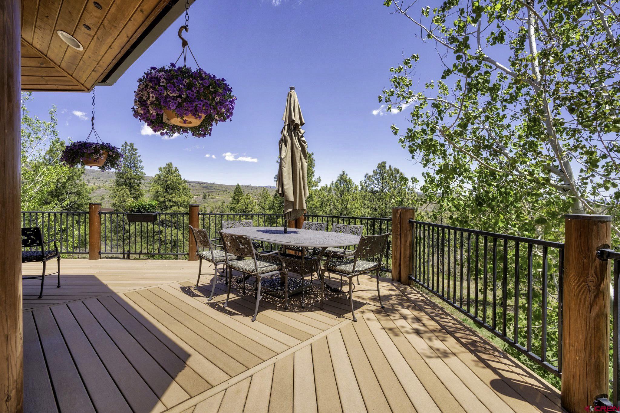 50 West Durango Ridge Road Durango, CO 81301 - Photo 11 of 45 a view of a patio with table and chairs and potted plants