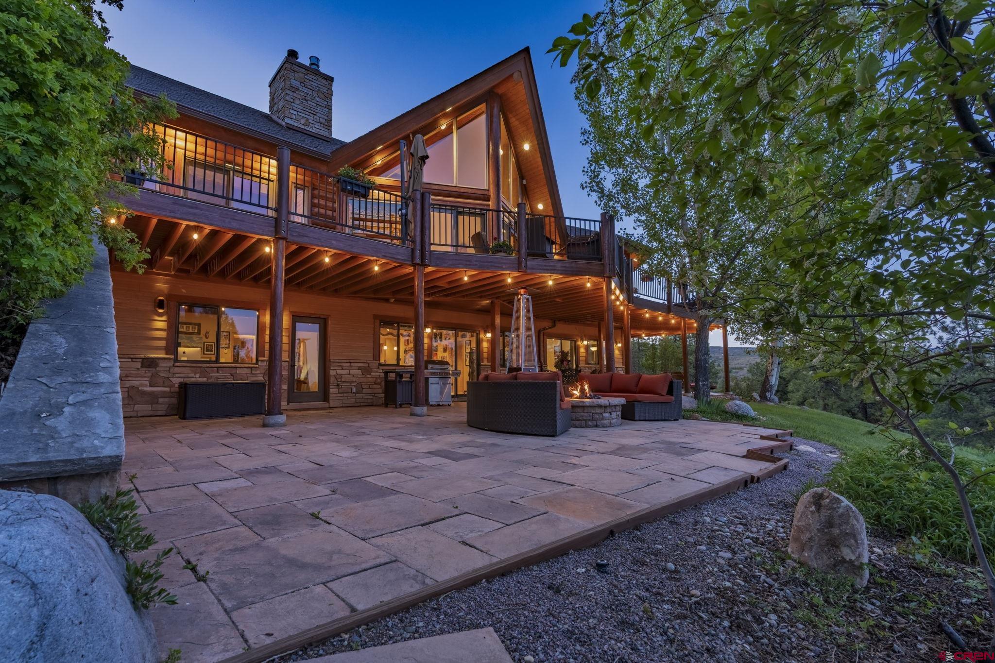 50 West Durango Ridge Road Durango, CO 81301 - Photo 16 of 45 a view of a house with a yard and sitting area