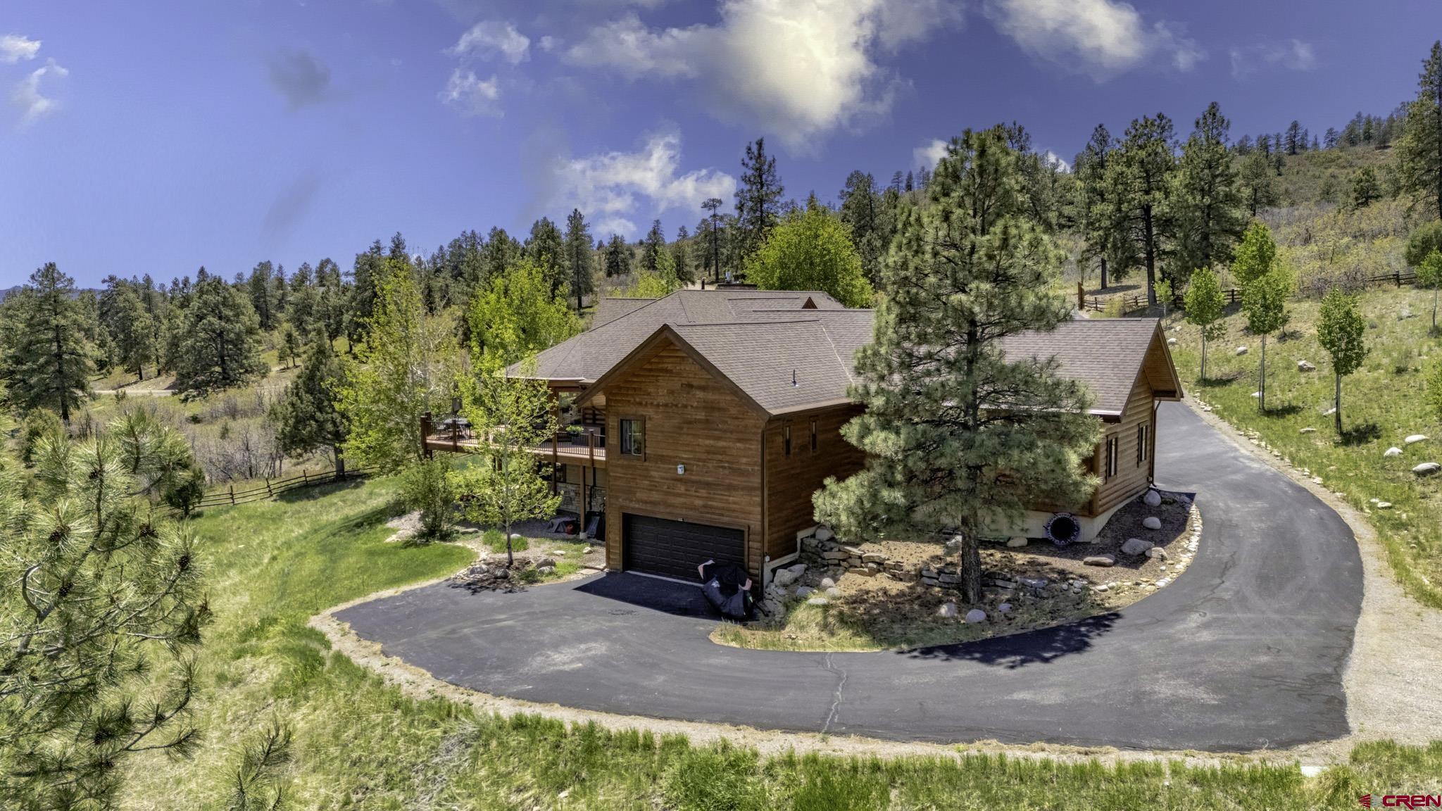 50 West Durango Ridge Road Durango, CO 81301 - Photo 19 of 45 a view of a house with a yard and potted plants