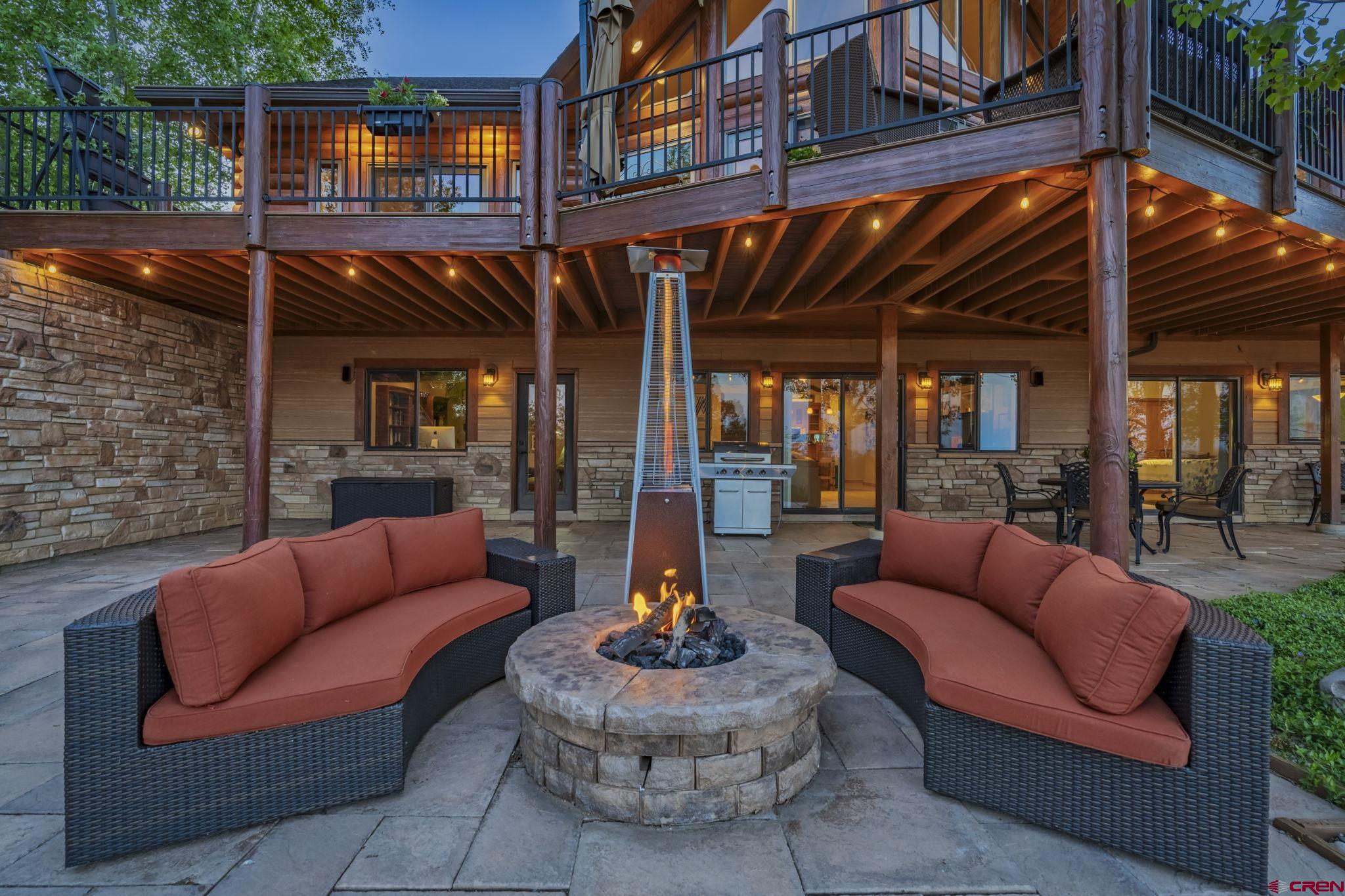 50 West Durango Ridge Road Durango, CO 81301 - Photo 2 of 45 a outdoor living space with patio furniture and a fireplace
