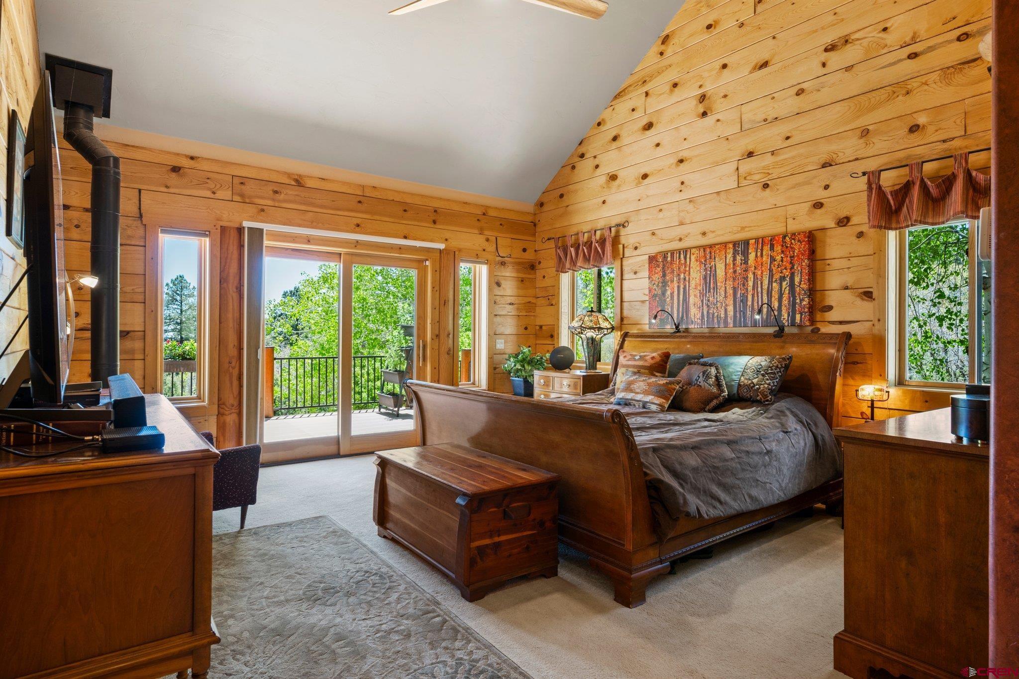 50 West Durango Ridge Road Durango, CO 81301 - Photo 22 of 45 a bedroom with a large bed and a large window