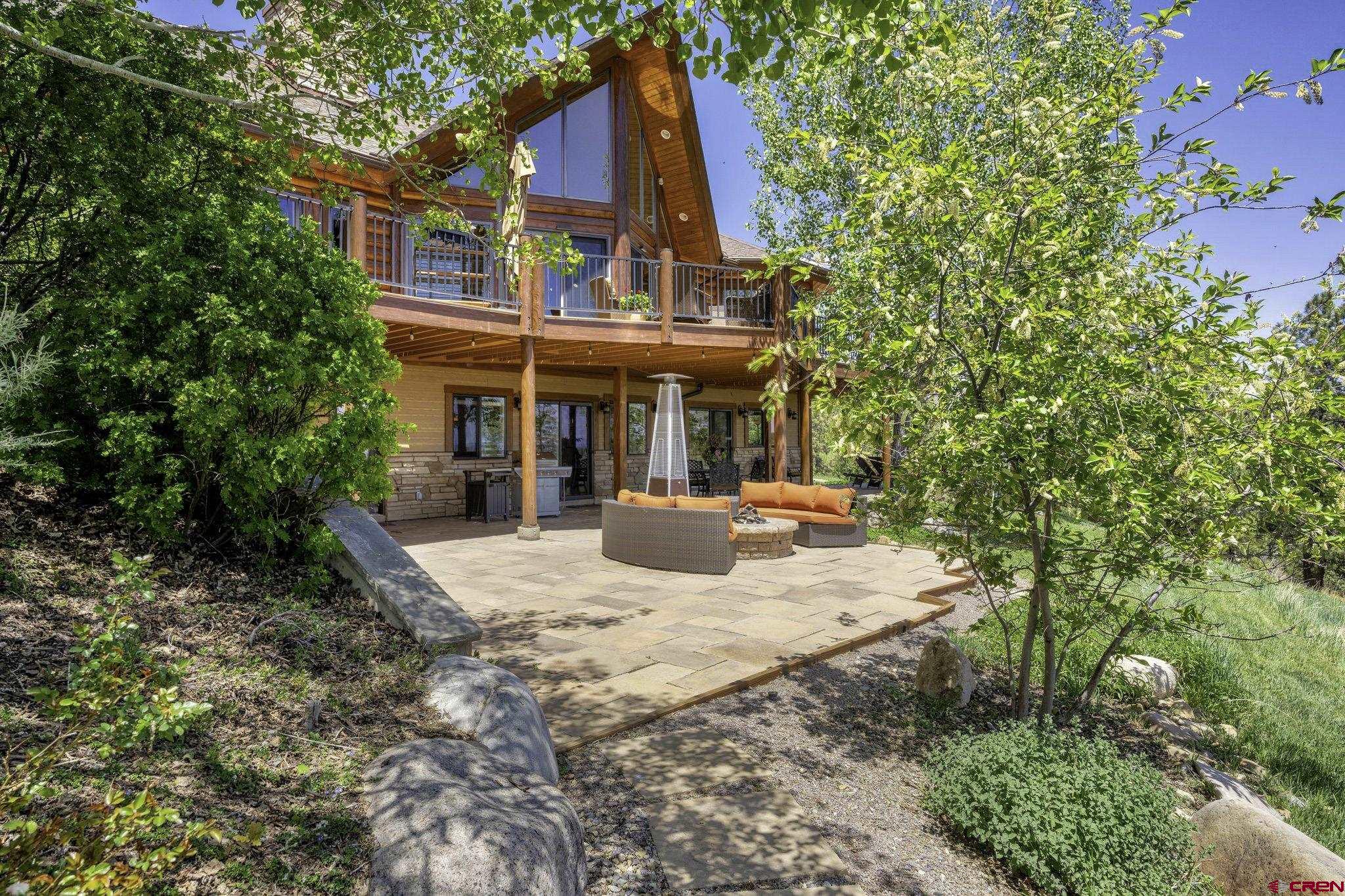 50 West Durango Ridge Road Durango, CO 81301 - Photo 26 of 45 a view of a house with backyard and sitting area
