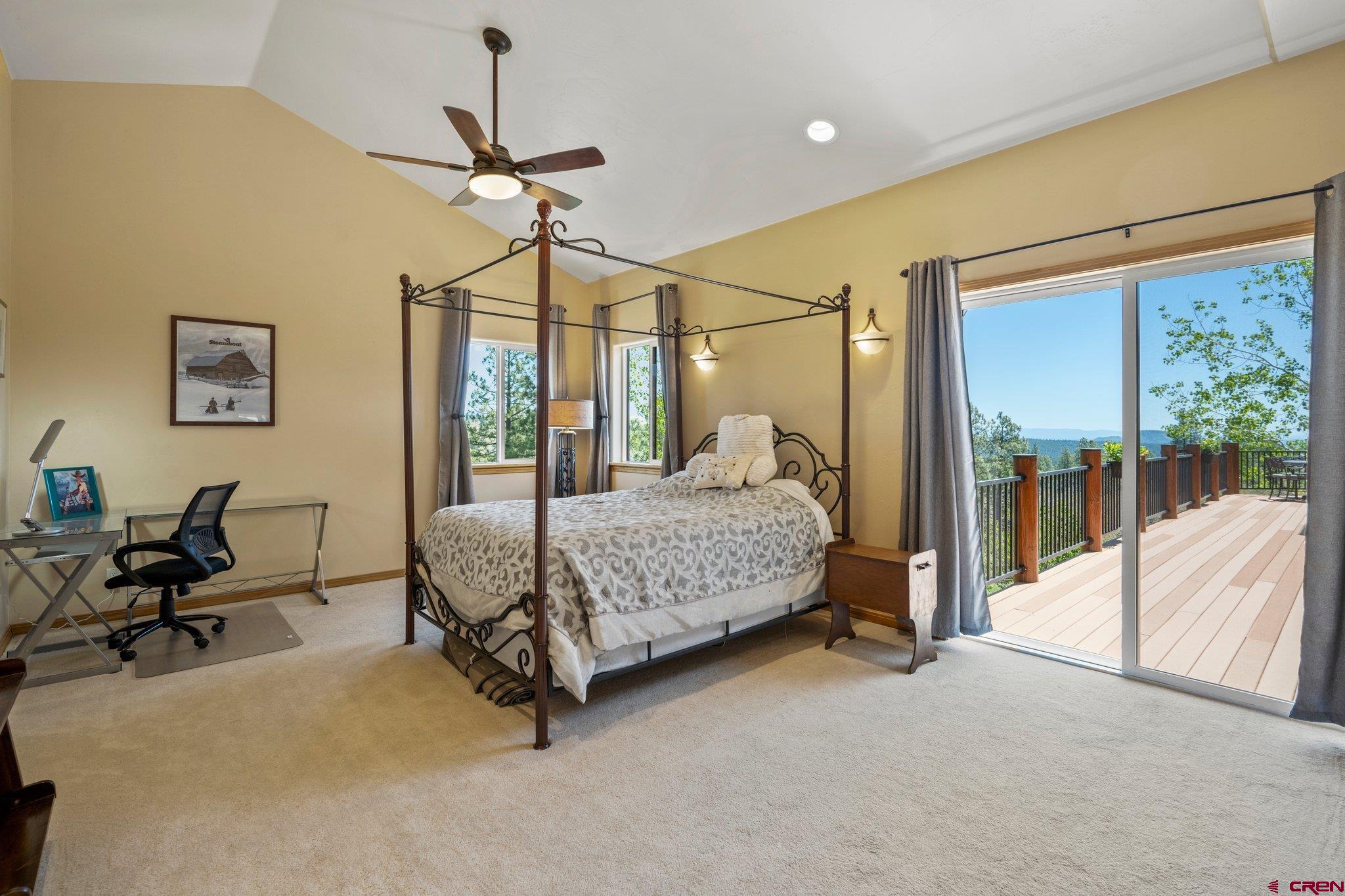 50 West Durango Ridge Road Durango, CO 81301 - Photo 27 of 45 a bedroom with a bed and large window